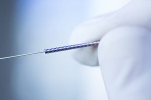 Close-up of a precision medical spring, manufactured by MSP Micro Spring Products in Chennai