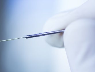 Close-up of a precision medical spring, manufactured by MSP Micro Spring Products in Chennai